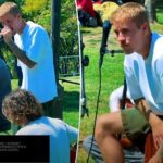 Justin Bieber canta com microfone durante apresentação improvisada no MacArthur Park, em Los Angeles