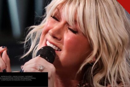 Cantora Natalie Grant cantando com os olhos fechados em apresentação ao vivo