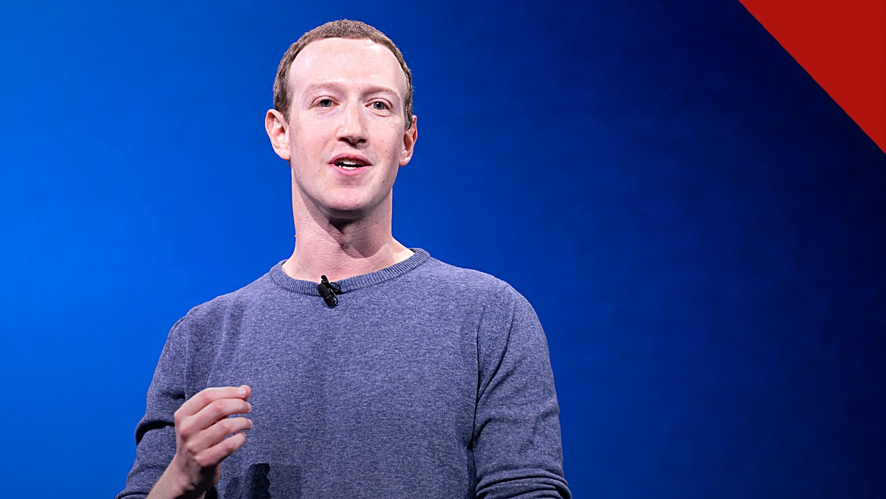 Zuckerberg avalia deixar a Califórnia: Mark Zuckerberg falando ao microfone em conferência da Meta, sobre fundo azul, com o rosto bem iluminado