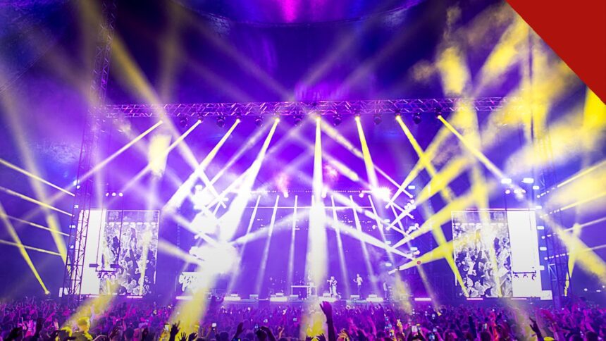 MC Guimê anuncia transição para o gospel em apresentação de despedida do funk após 17 anos de carreira, e a imagem mostra uma plateia diante de palco iluminado em show, em foto ilustrativa de arquivo