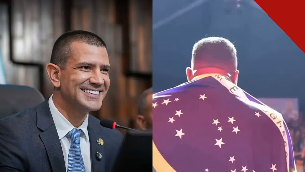 Douglas Ruas e o pastor Chris Beleke com a bandeira do Brasil nos ombros