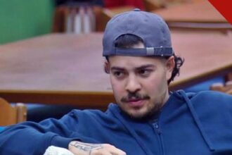 Jottapê desiste de A Fazenda 18: o cantor, de boné e moletom azul, em momento de tensão na sede do reality da Record
