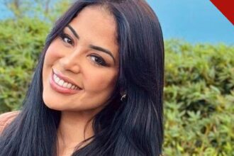 Retrato da cantora gospel Gisele Nascimento sorrindo ao ar livre