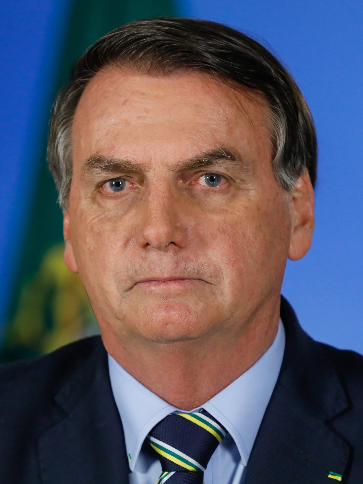 Michelle Bolsonaro pede união entre apoiadores, e a imagem mostra Jair Bolsonaro sorrindo em retrato de arquivo, o ex-presidente cuja gratidão aos apoiadores foi transmitida por Michelle na mensagem desta sexta-feira