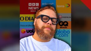 Quem é o Hugo Gospel: Gabriel Ribeiro, jornalista e criador do portal, em foto oficial diante do painel de veículos que já citaram o site